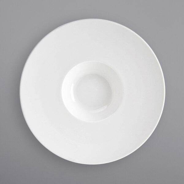 A bright white porcelain bowl with an extra wide rim and a round center.