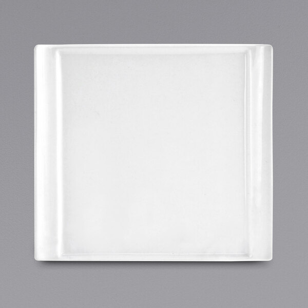 A white rectangular porcelain plate with a silver edge.
