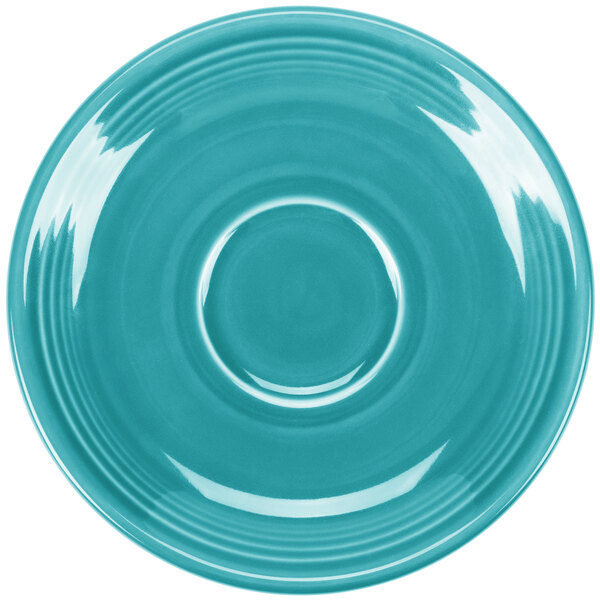 A turquoise Fiesta saucer with a white rim and circle in the middle.