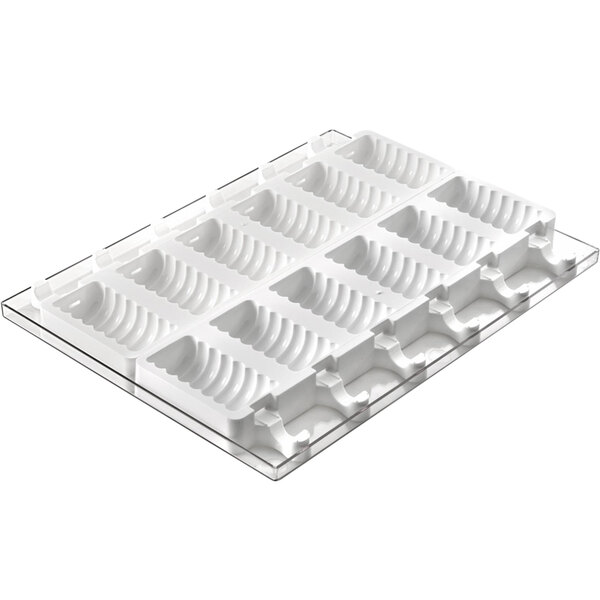 A white plastic Silikomart tray with six cake pop compartments.
