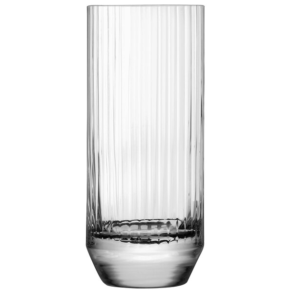 A close up of a Nude Big Top highball glass with a ribbed rim.