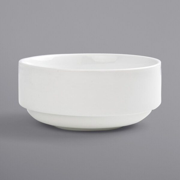 A Front of the House Monaco bright white porcelain bowl on a gray background.