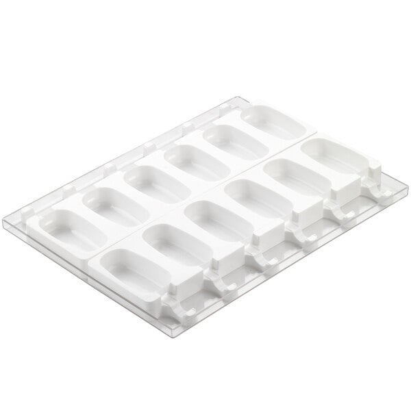 A white plastic Silikomart tray with six compartments with holes in it.