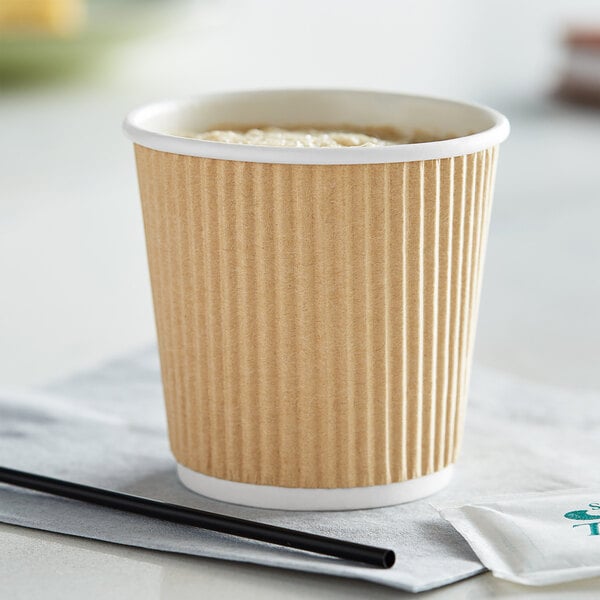 A Choice sleeveless kraft paper hot cup with a white rim full of coffee.