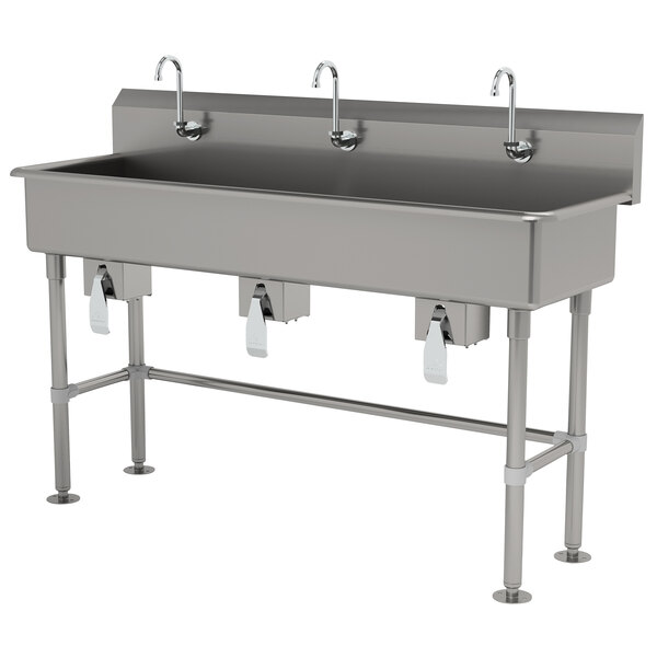 An Advance Tabco stainless steel multi-station hand sink with faucets.