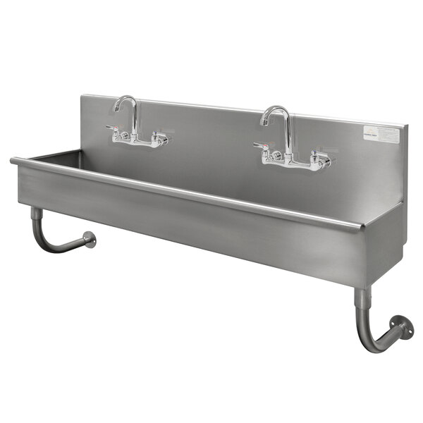 An Advance Tabco stainless steel multi-station hand sink with two faucets.