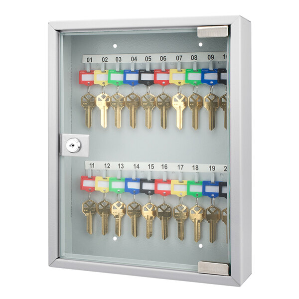A Barska gray steel key cabinet with glass door holding keys.