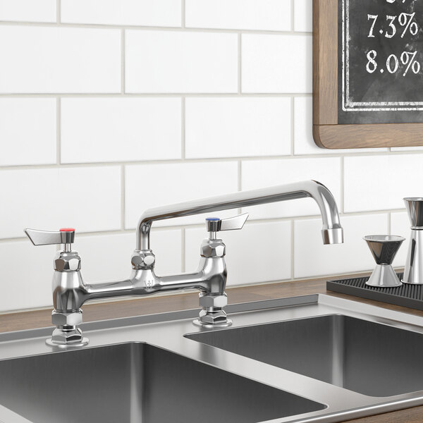 A Waterloo deck-mounted faucet with a 14" swing nozzle above a metal sink.