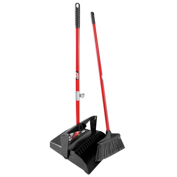 A Libman lobby broom and dustpan with a red handle.