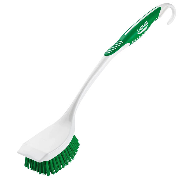 A white Libman long handle scrub brush with a green and white scraper edge.