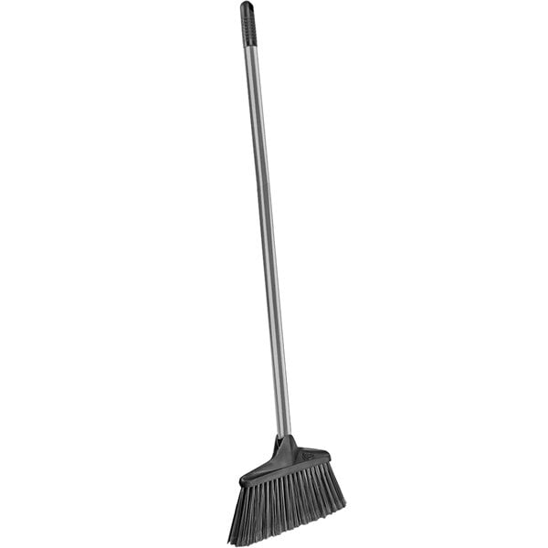 A Libman Housekeeper broom with a long black handle.
