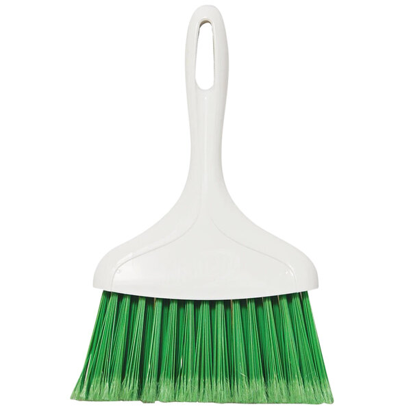A white and green whisk broom with a handle.