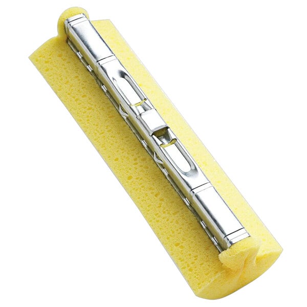 A yellow sponge with a metal clip on it.
