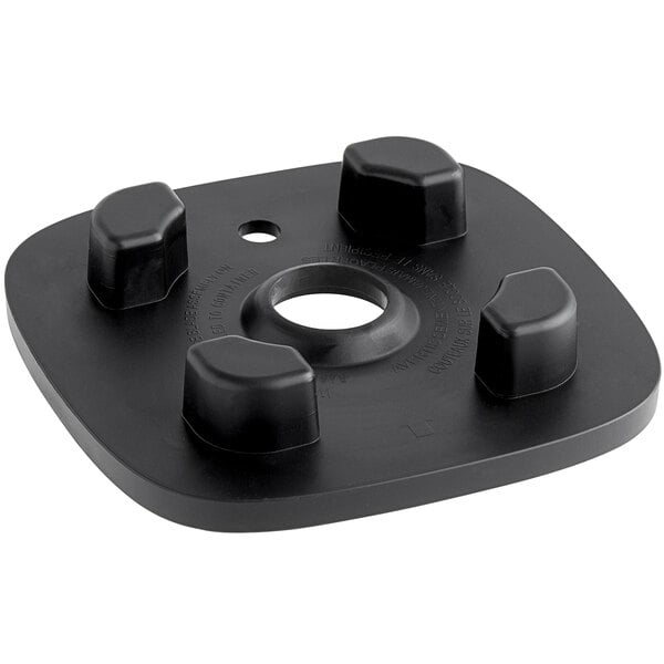 A black plastic square with four holes.