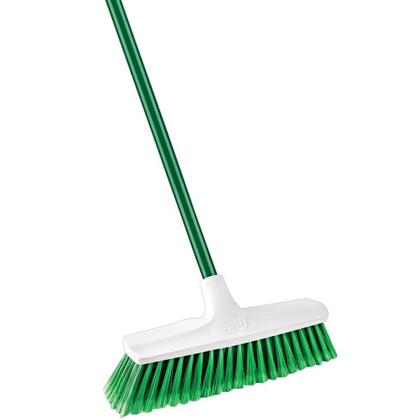 A green and white Libman Housekeeper push broom.