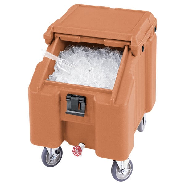 A brown Cambro SlidingLid&#8482; mobile ice bin filled with ice.