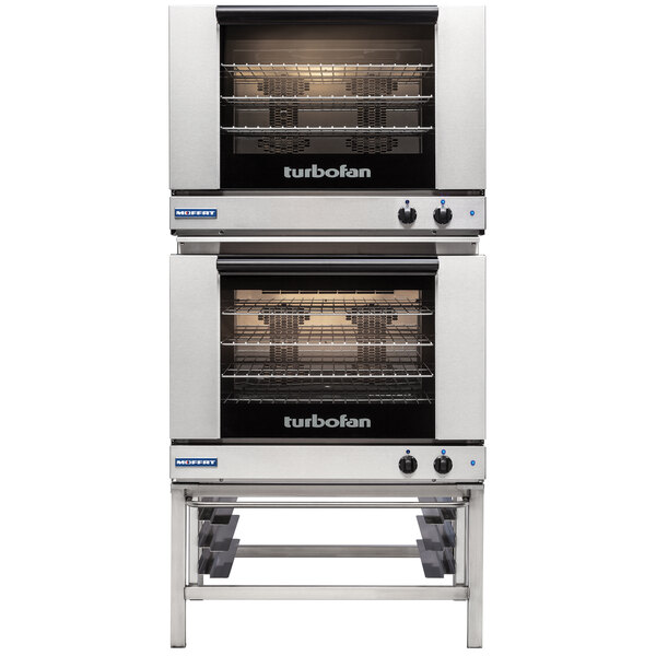 A stainless steel Moffat double deck convection oven with knobs.