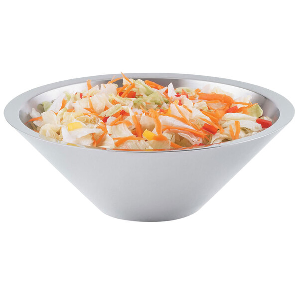 A Vollrath Double Wall Conical metal bowl filled with chopped vegetables and salad.