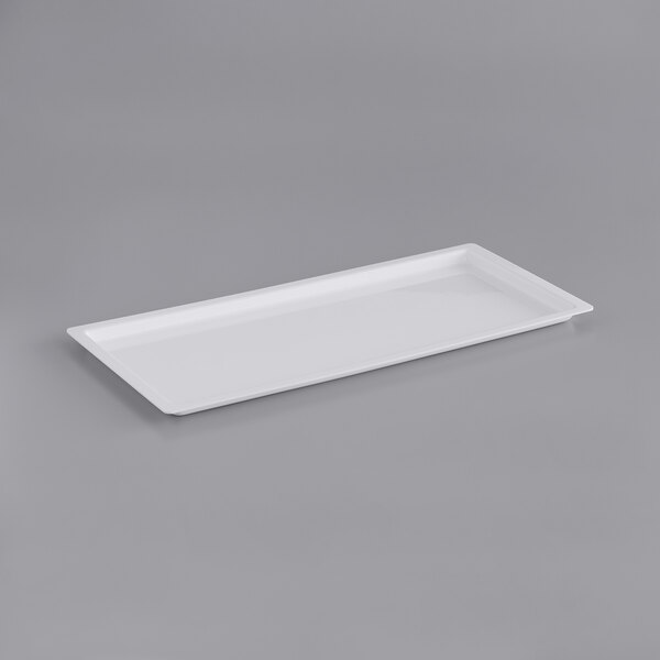 A white rectangular tray with a light on a gray background.
