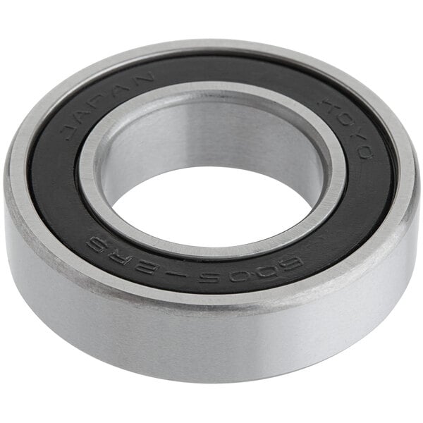 A close-up of a stainless steel Estella dough sheeter bearing with a black rubber seal.