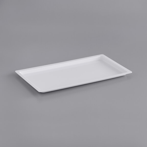 A white rectangular powder shield on a gray surface.