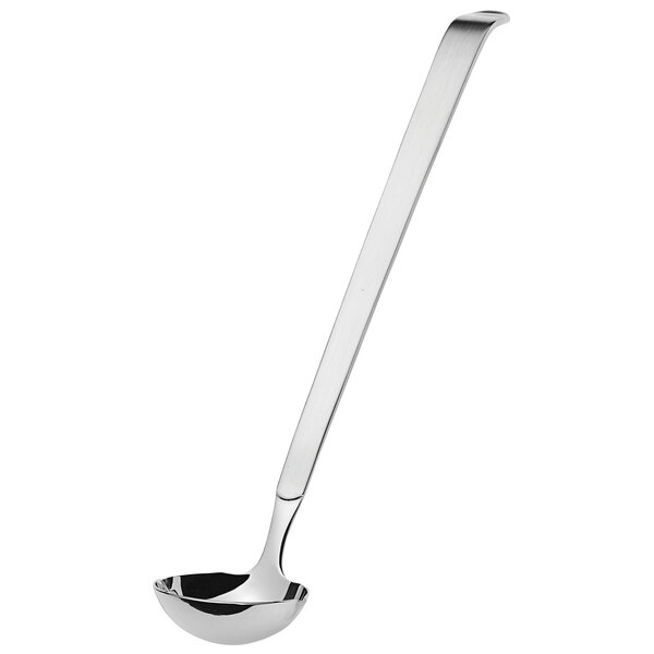 An Amefa stainless steel dressing spoon with a long handle.