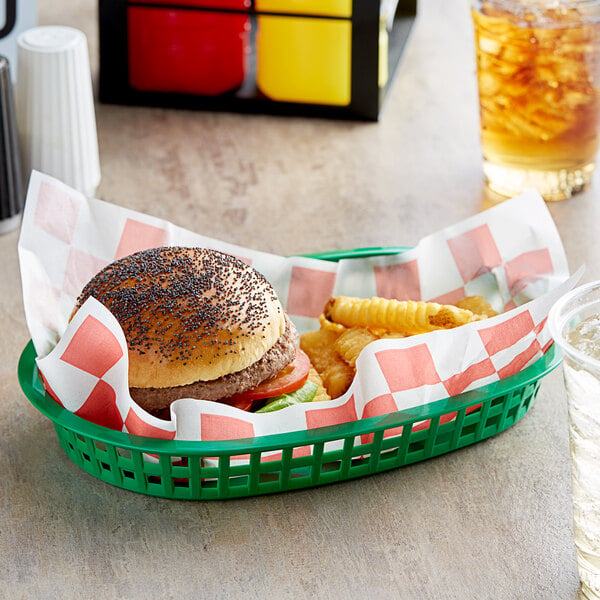 A red check Choice basket liner with a hamburger and fries in a basket.