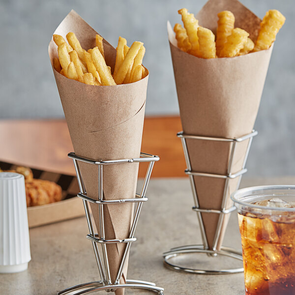 French fries in Choice deli wrap paper cones on a table.