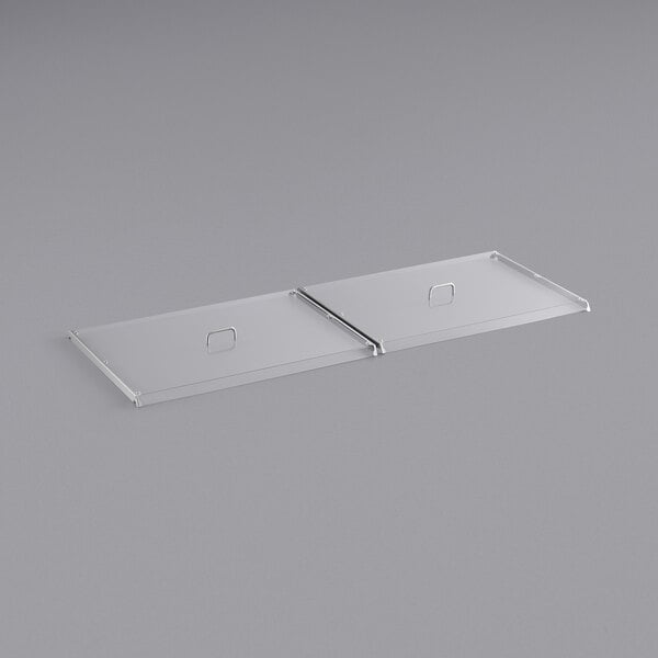 Two clear plastic pan covers with metal handles.