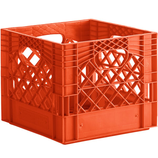 An orange plastic milk crate with holes and a handle.