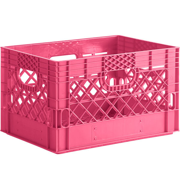 A pink plastic rectangular milk crate with handles.