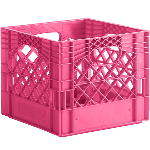 A pink plastic milk crate with customizable holes and handles.