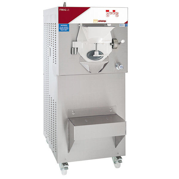 A Cattabriga commercial ice cream machine with a stainless steel base and white cover on wheels.