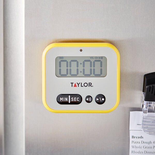 A Taylor digital kitchen timer with numbers on the display.