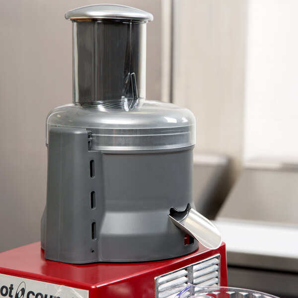 A Robot Coupe Cuisine Kit juicer on a counter.