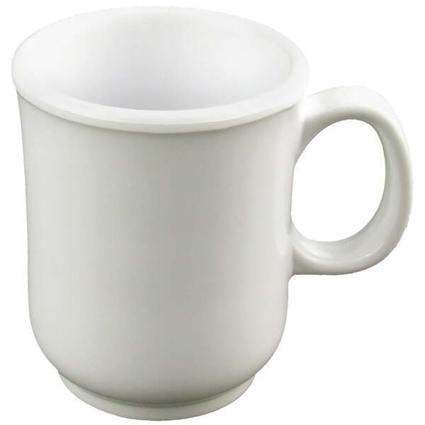 A close-up of a white mug with a handle.