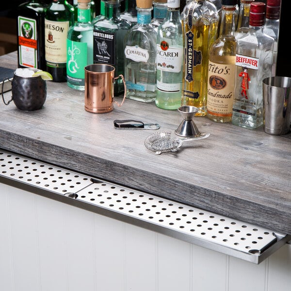 A 36" stainless steel underbar mount beer drip tray installed on a bar counter.