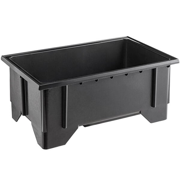 A black plastic Vollrath machined well with an open drain.