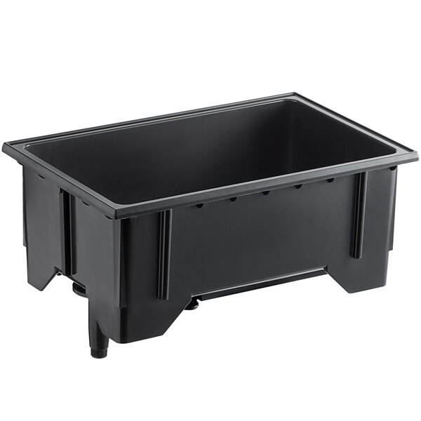 A black plastic Vollrath ServeWell well assembly with a drain and element on a table.