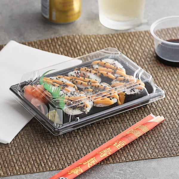 A plastic Emperor's Select sushi container with sushi inside.