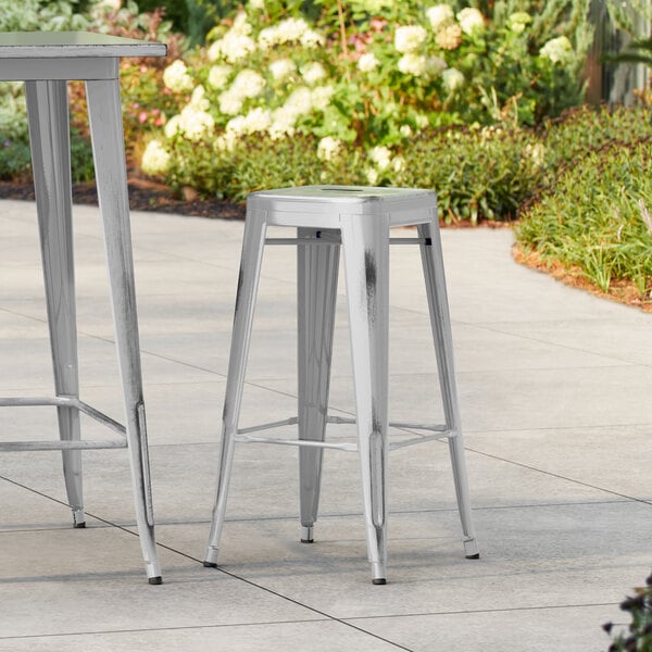 Lancaster Table & Seating Alloy Series Distressed Silver Outdoor Backless Barstool