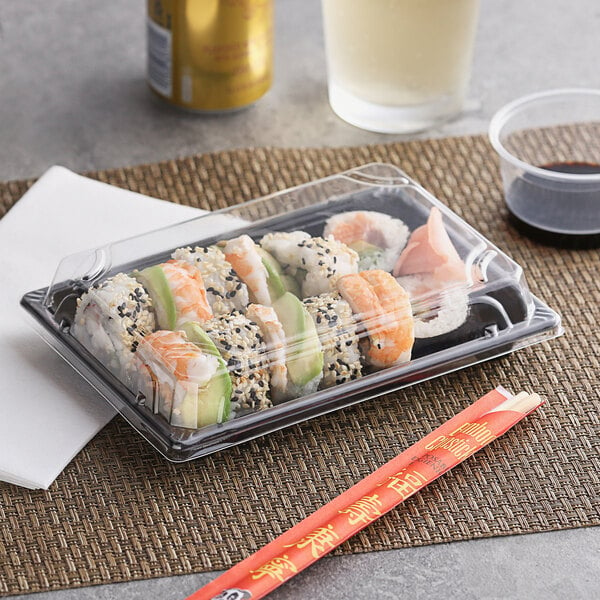 Emperor's Select sushi in a plastic container with chopsticks.