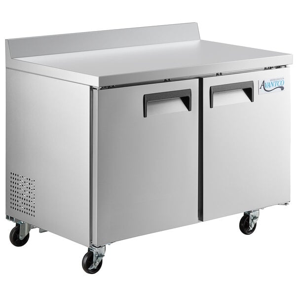 An Avantco stainless steel worktop freezer with a 3 1/2" backsplash on wheels.