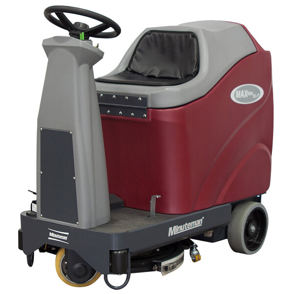 A red and gray Minuteman Max Ride 20 ECO cordless ride-on floor scrubber with a seat and wheels.