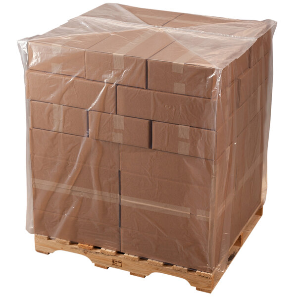 A pallet with a clear plastic bag wrapped around it.