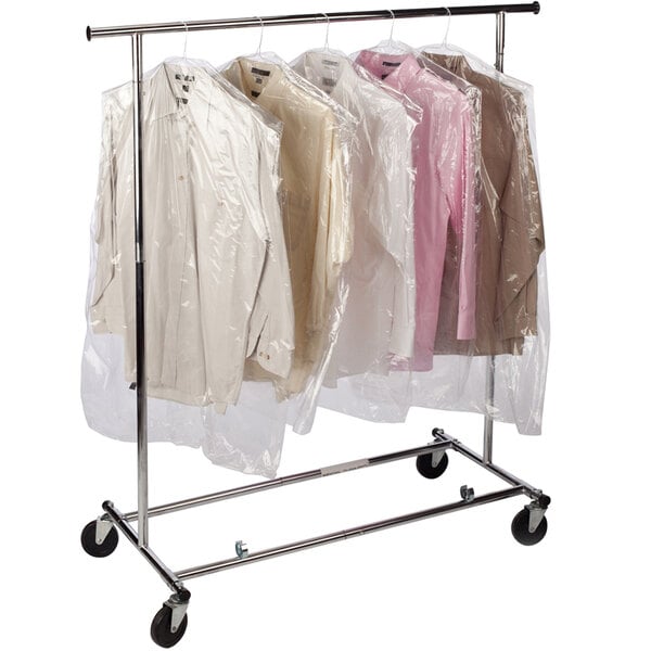 A rack with three shirts and two dresses in a Lavex clear polyethylene garment bag.