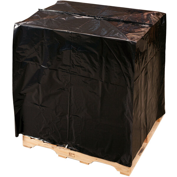 A roll of black Lavex plastic sheeting covering a wooden pallet.