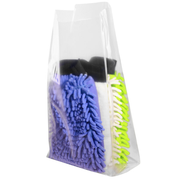 A roll of clear plastic bags holding colorful microfiber cloths.