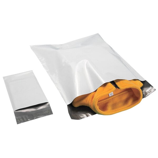A white plastic bag with a black strip and tamper-evident adhesive closure containing a yellow jacket.