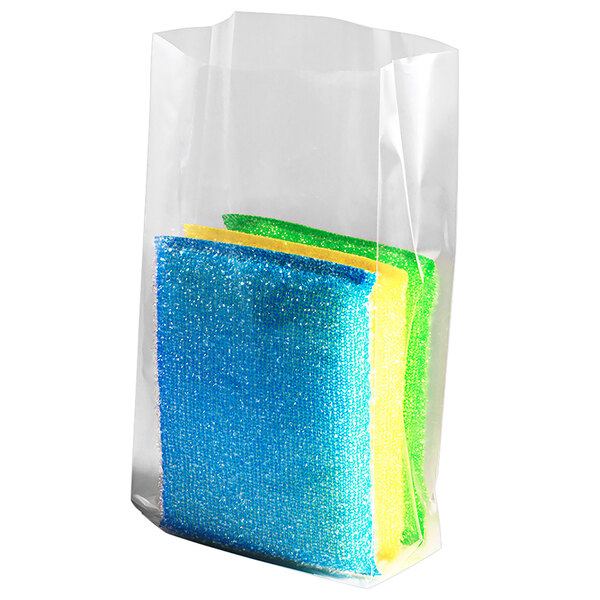 A clear plastic bag with a group of colorful sponges inside.